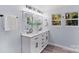 Double vanity bathroom with white cabinets and black accents at 480 Wyatt Grove Church Rd, Gold Hill, NC 28071