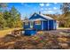 Blue house with a patio and a wooden table at 480 Wyatt Grove Church Rd, Gold Hill, NC 28071