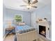 Light and airy bedroom with a fireplace at 480 Wyatt Grove Church Rd, Gold Hill, NC 28071