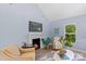 Cozy living room features a fireplace, comfy seating, and large windows at 480 Wyatt Grove Church Rd, Gold Hill, NC 28071