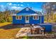 Blue house with a patio and wooden bench at 480 Wyatt Grove Church Rd, Gold Hill, NC 28071