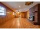 Living room boasts hardwood floors, brick fireplace, and built-in shelving at 2926 Englewood Dr, Shelby, NC 28150