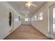 Bright sunroom with carpeted floors, multiple windows, and ceiling fans at 2926 Englewood Dr, Shelby, NC 28150