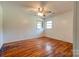 Bright bedroom with hardwood floors and ceiling fan at 2926 Englewood Dr, Shelby, NC 28150