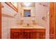Bathroom with pink tile, vanity sink, and shower at 2926 Englewood Dr, Shelby, NC 28150