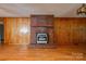 Brick fireplace with wood mantel in living room at 2926 Englewood Dr, Shelby, NC 28150