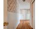 Hallway with wood floors and floral wallpaper at 2926 Englewood Dr, Shelby, NC 28150