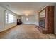 Living room with brick fireplace and piano at 2926 Englewood Dr, Shelby, NC 28150