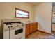 Kitchen area with wood cabinets and vintage stove at 2926 Englewood Dr, Shelby, NC 28150