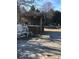 Wooden patio with bar and seating area, overlooking yard at 8540 Indian Summer Trl, Harrisburg, NC 28075