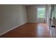 Bedroom with hardwood floors and a large window at 1018 Carysbrook Ln, Charlotte, NC 28217