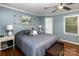 Main bedroom with hardwood floors and a calming color scheme at 118 Taylor Ct, Mooresville, NC 28117