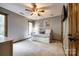 Bedroom with daybed, ceiling fan, and wood closet doors at 16008 Samar Ct, Tega Cay, SC 29708