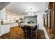 Bright kitchen with white cabinets, granite counters, and stainless steel appliances at 16008 Samar Ct, Tega Cay, SC 29708