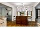 Kitchen island with seating and storage in a kitchen with wood floors at 16008 Samar Ct, Tega Cay, SC 29708