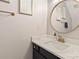 Modern bathroom with a quartz vanity and gold fixtures at 2876 Oakhurst Dr, Rock Hill, SC 29732