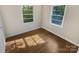 Bright bedroom with hardwood floors and large windows at 2614 Bancroft St, Charlotte, NC 28206