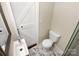 Clean bathroom with marble flooring and modern vanity at 2614 Bancroft St, Charlotte, NC 28206