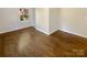 Hardwood floors and a window in this bright bedroom at 2614 Bancroft St, Charlotte, NC 28206