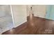 Hardwood floor living room with view into kitchen at 2614 Bancroft St, Charlotte, NC 28206