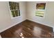 Charming bedroom with hardwood floors and two windows at 2614 Bancroft St, Charlotte, NC 28206