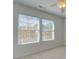 Bedroom with two windows, ceiling fan, and neutral walls at 620 Smokehouse Ln, Albemarle, NC 28001