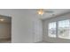 Bedroom with window, door, and ceiling fan at 620 Smokehouse Ln, Albemarle, NC 28001