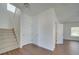 Modern staircase with carpeted steps and neutral walls at 620 Smokehouse Ln, Albemarle, NC 28001