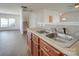 Kitchen with double sinks and a view into the adjacent dining area at 620 Smokehouse Ln, Albemarle, NC 28001