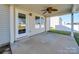 Covered patio with ceiling fan and access door at 620 Smokehouse Ln, Albemarle, NC 28001