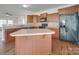 Modern kitchen featuring an island and stainless steel appliances at 620 Smokehouse Ln, Albemarle, NC 28001
