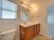 Bathroom with double vanity and toilet at 620 Smokehouse Ln, Albemarle, NC 28001