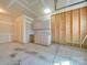 Unfinished garage with built-in cabinets and workspace at 620 Smokehouse Ln, Albemarle, NC 28001
