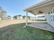 Covered patio with ceiling fan, overlooking a spacious backyard at 620 Smokehouse Ln, Albemarle, NC 28001