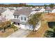 Two-story house with gray siding, two-car garage, and backyard at 620 Smokehouse Ln, Albemarle, NC 28001