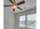 Bright bedroom with two windows, ceiling fan, and neutral walls at 620 Smokehouse Ln, Albemarle, NC 28001