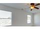 Bright bedroom with two windows and ceiling fan at 620 Smokehouse Ln, Albemarle, NC 28001