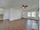 Open living room with hardwood floors and a fireplace at 620 Smokehouse Ln, Albemarle, NC 28001