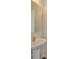 Small bathroom with pedestal sink and octagon mirror at 620 Smokehouse Ln, Albemarle, NC 28001