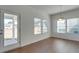 Dining area with hardwood floors, access to backyard, and window lighting at 620 Smokehouse Ln, Albemarle, NC 28001
