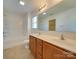 Bathroom with double vanity, bathtub, and toilet at 620 Smokehouse Ln, Albemarle, NC 28001