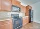 Kitchen boasting a microwave, oven, and refrigerator at 620 Smokehouse Ln, Albemarle, NC 28001