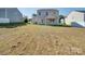 Backyard view of house and grassy area at 620 Smokehouse Ln, Albemarle, NC 28001