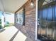 Inviting front porch with stone accents and black front door at 620 Smokehouse Ln, Albemarle, NC 28001