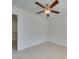 Spacious bedroom with ceiling fan and access to another room at 620 Smokehouse Ln, Albemarle, NC 28001