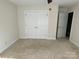 Spacious bedroom with double doors to closet and carpet flooring at 103 Berea Baptist Church Rd, Stanfield, NC 28163