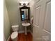 Small powder room with pedestal sink and toilet at 103 Berea Baptist Church Rd, Stanfield, NC 28163