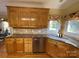 Kitchen with granite countertops, sink, and dishwasher at 103 Berea Baptist Church Rd, Stanfield, NC 28163
