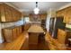 Spacious kitchen with granite countertops, stainless steel appliances, and an island at 103 Berea Baptist Church Rd, Stanfield, NC 28163