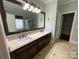 Elegant bathroom with double vanity, large mirror, and shower at 103 Berea Baptist Church Rd, Stanfield, NC 28163